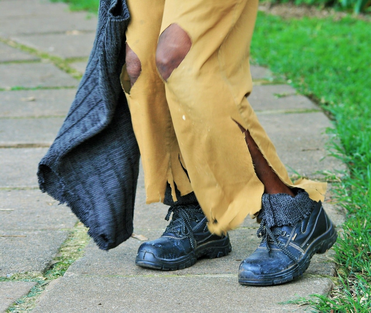 homeless with torn yellow pants